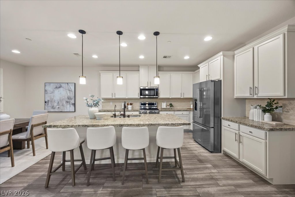 2572 Sable Ridge Street Henderson, NV 89044 - Photo 5 of 83 Wonderful bar to visit or everyday dining! HUGE island!