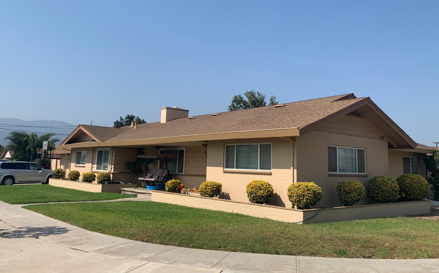 461 Soledad Street Soledad, CA 93960 - Photo 2 of 21 a front view of a house with a yard and garage