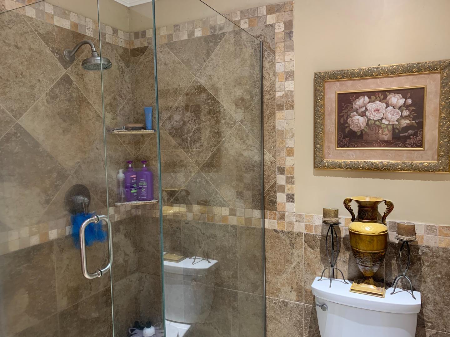 461 Soledad Street Soledad, CA 93960 - Photo 16 of 21 a bath room with a toilet and a shower