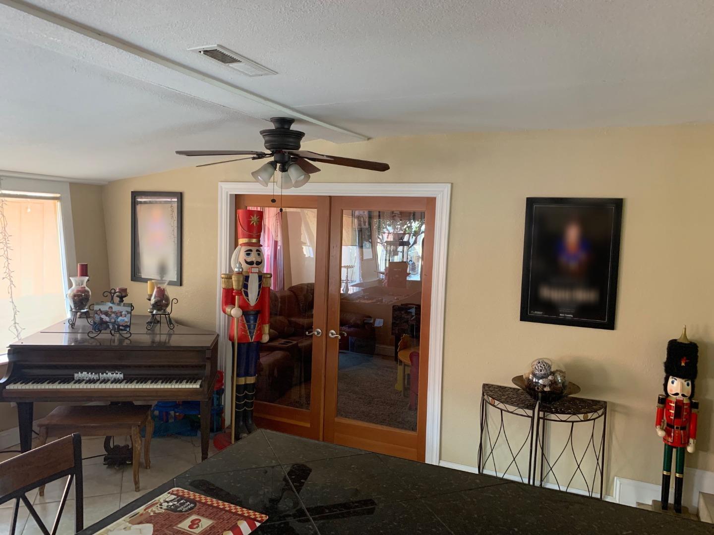 461 Soledad Street Soledad, CA 93960 - Photo 20 of 21 a living room with furniture and a flat screen tv