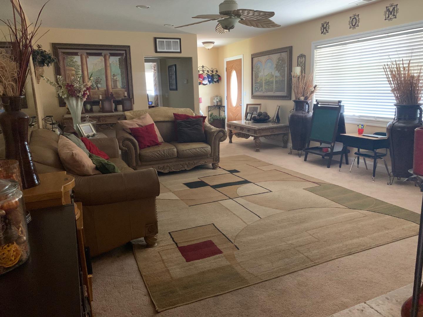 461 Soledad Street Soledad, CA 93960 - Photo 3 of 21 a living room with furniture and a large window