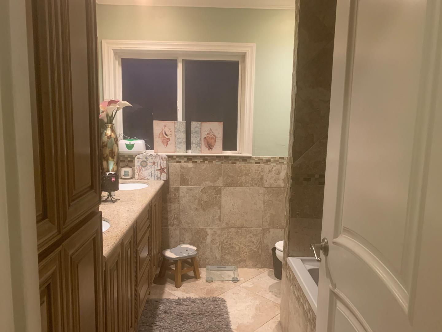 461 Soledad Street Soledad, CA 93960 - Photo 8 of 21 a bathroom with a sink and a mirror