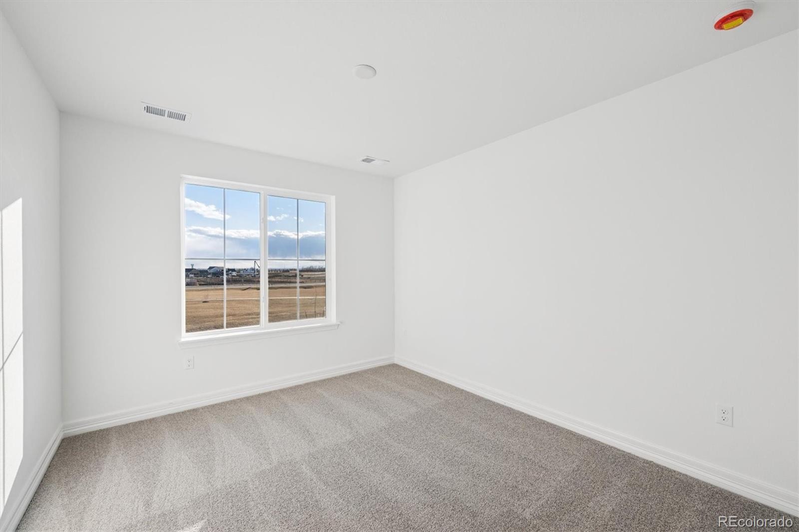 6120 Oban Road Timnath, CO 80547 - Photo 12 of 22 an empty room with a window