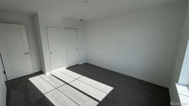 a view of a livingroom with stairs