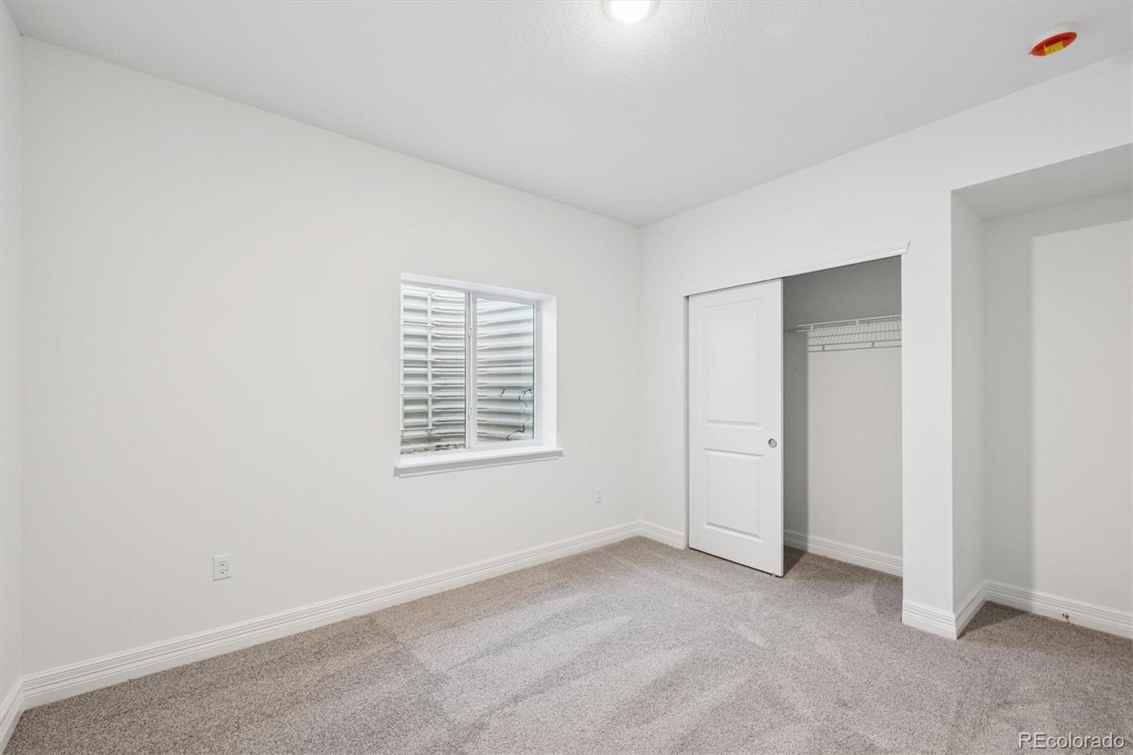 6120 Oban Road Timnath, CO 80547 - Photo 18 of 22 an empty room with windows