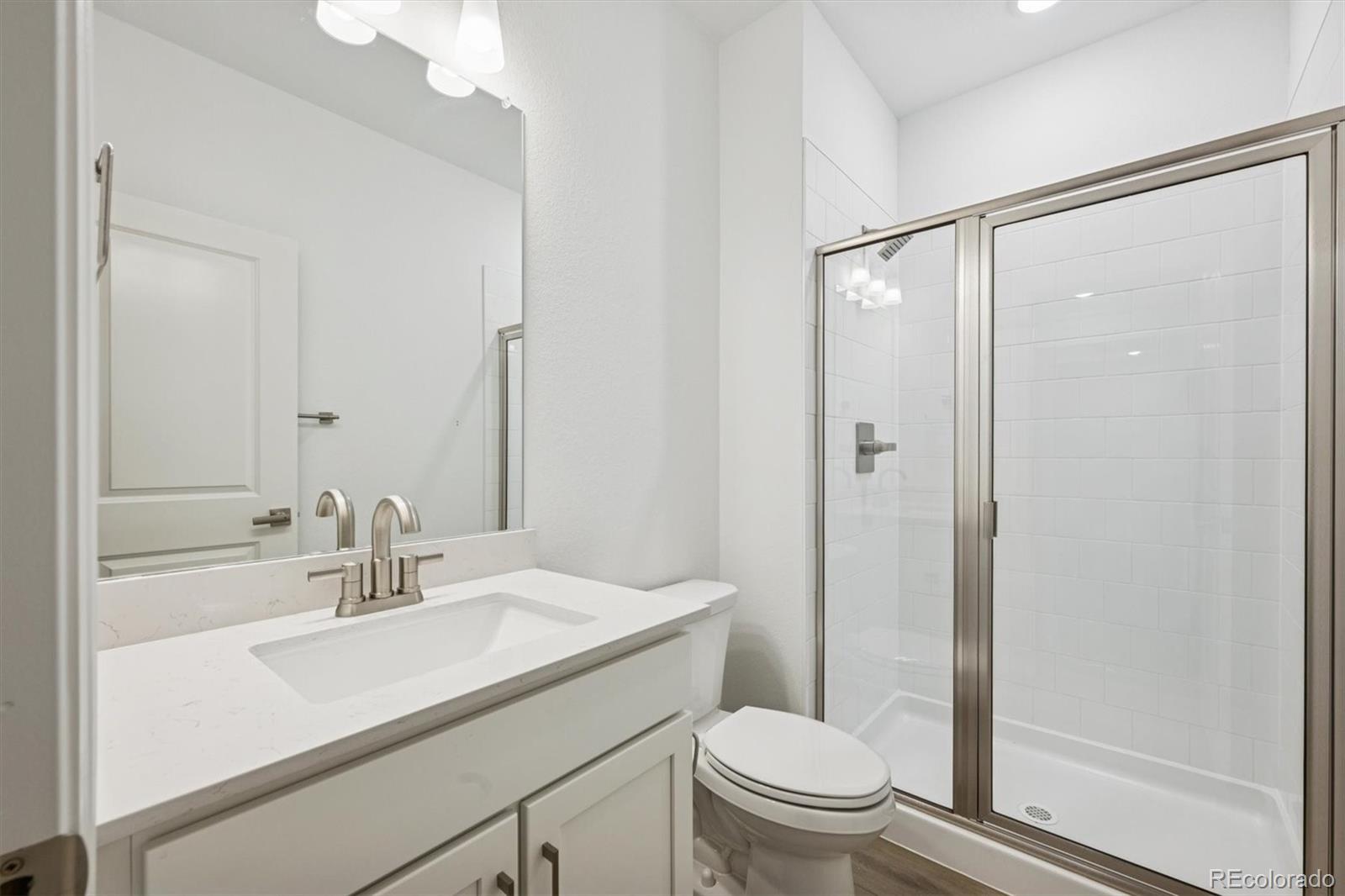 6120 Oban Road Timnath, CO 80547 - Photo 19 of 22 a bathroom with a sink toilet and shower