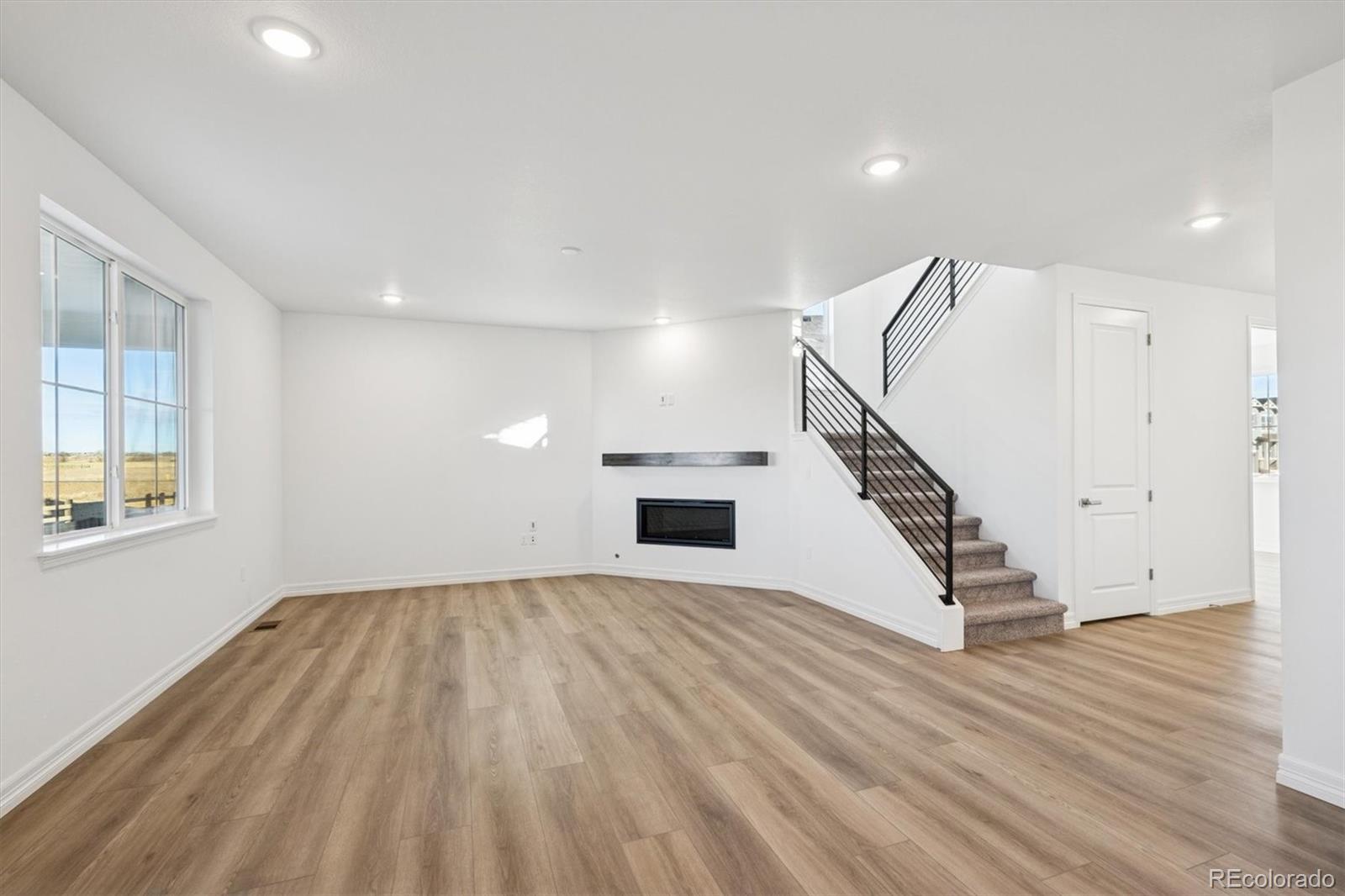 6120 Oban Road Timnath, CO 80547 - Photo 4 of 22 a view of entryway and hall with wooden floor