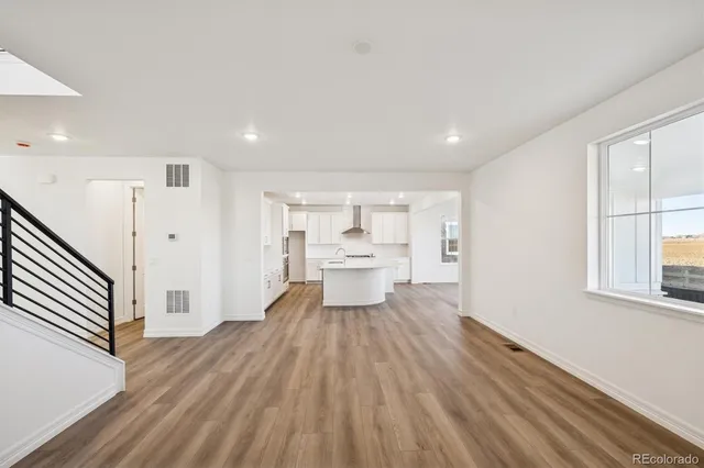 a view of a kitchen with wooden floor