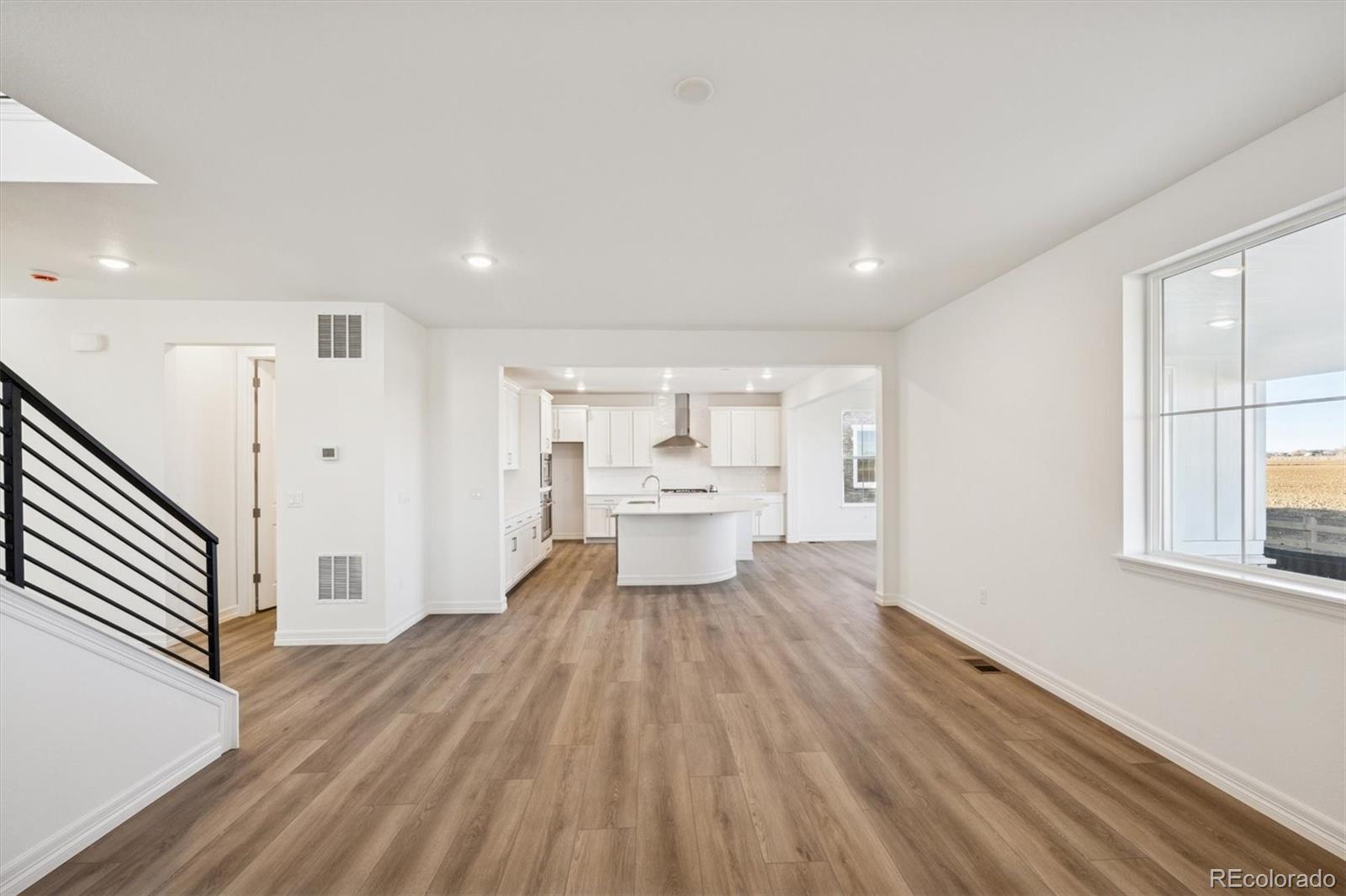 6120 Oban Road Timnath, CO 80547 - Photo 5 of 22 a view of a kitchen with wooden floor