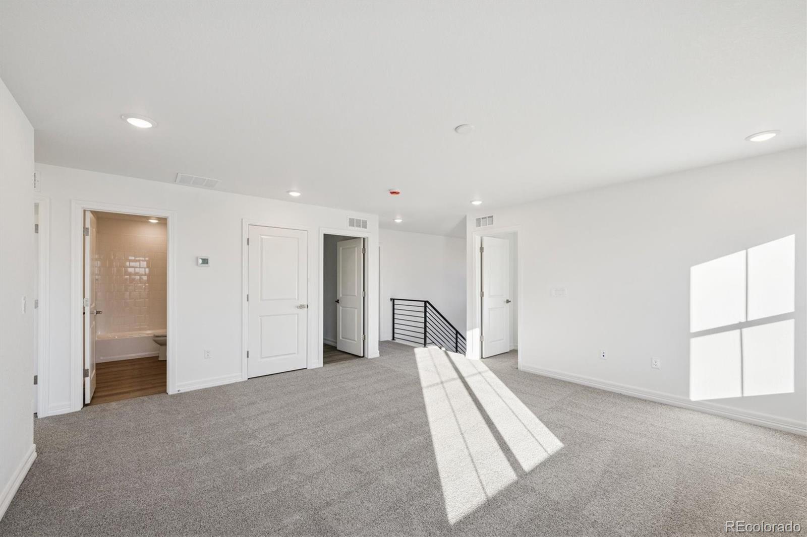6120 Oban Road Timnath, CO 80547 - Photo 9 of 22 an empty room with windows and closet