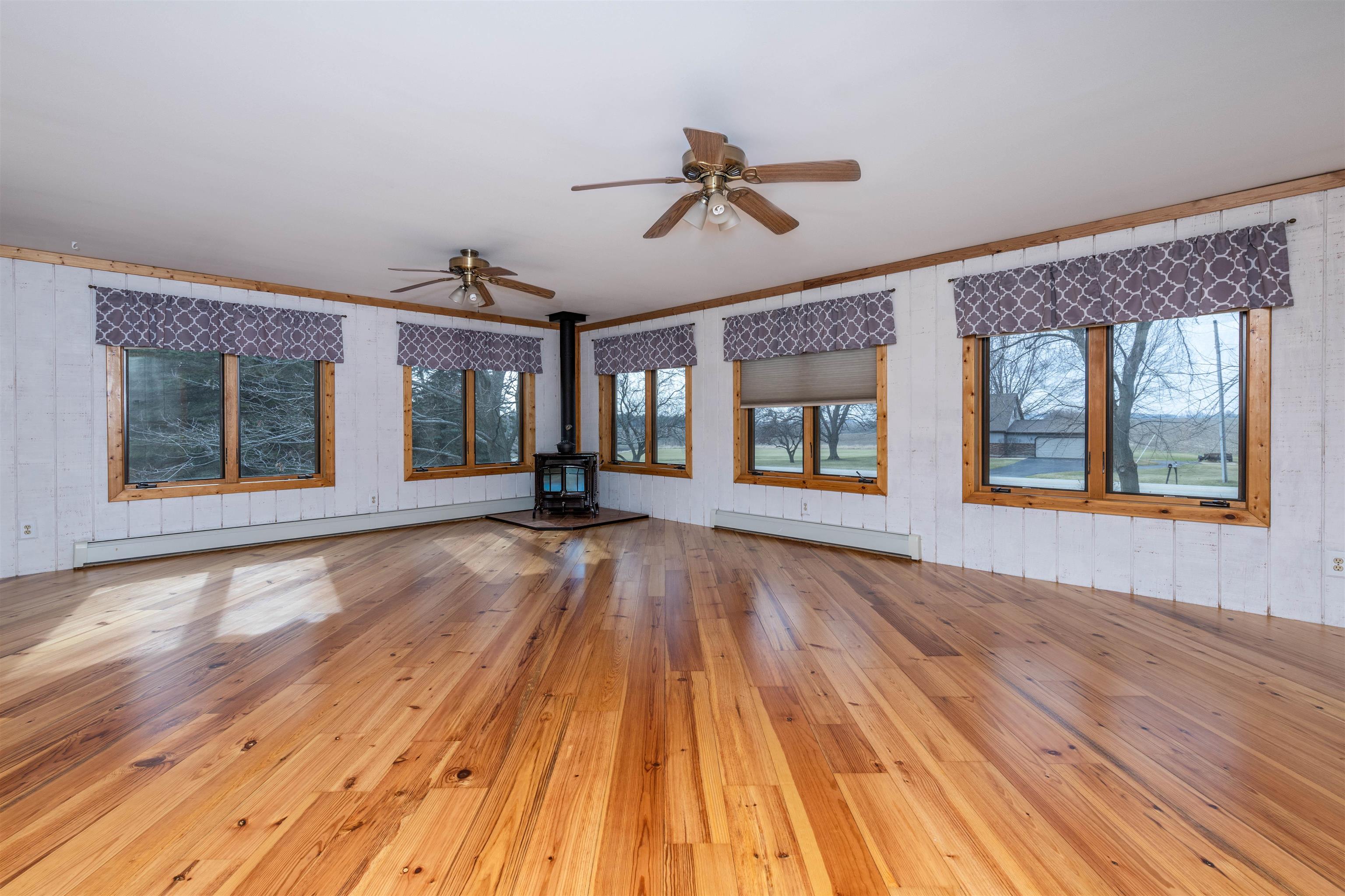 5178 Shattuck Road Belvidere, IL 61008 - Photo 15 of 46 a view of an empty room with wooden floor and a window