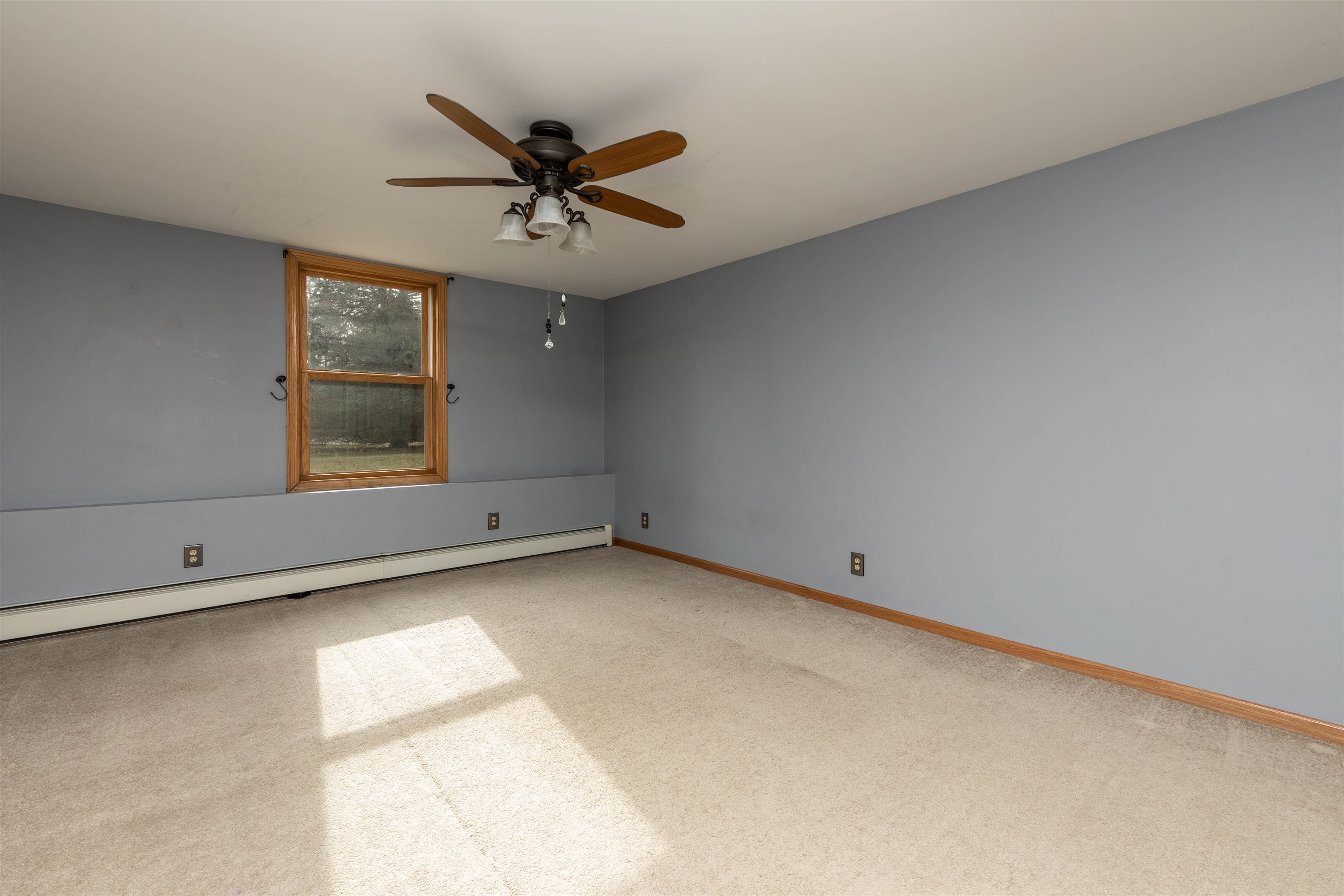 5178 Shattuck Road Belvidere, IL 61008 - Photo 25 of 46 a view of a big room with chandelier fan and windows