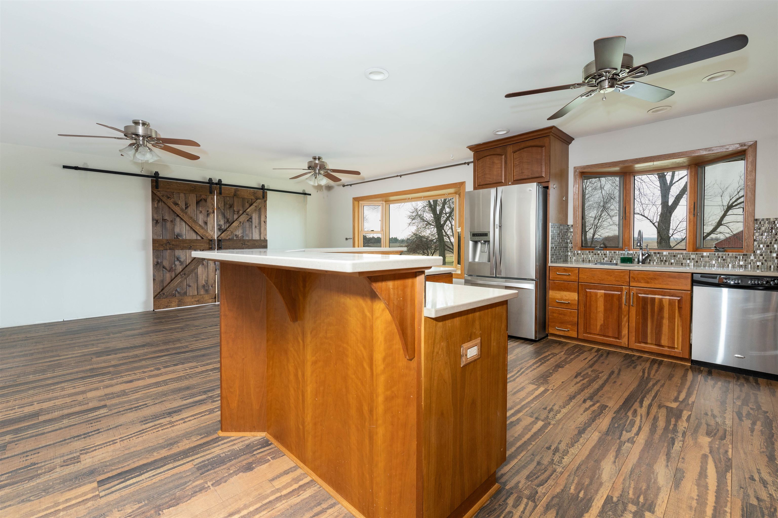 5178 Shattuck Road Belvidere, IL 61008 - Photo 9 of 46 a kitchen with stainless steel appliances granite countertop a white cabinets and wooden floor