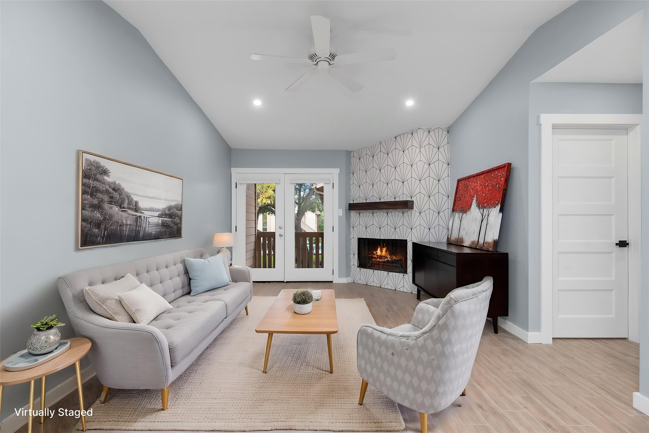 5000 Milwee Street, Unit 54 Houston, TX 77092 - Photo 3 of 25 Unwind by the fireplace or step out to the balcony — pool views and natural light make this living space an everyday retreat. Virtually staged.