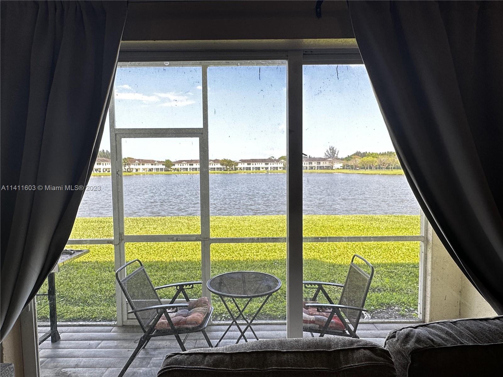 4322 Emerald Vista Lake Worth, FL 33461 - Photo 13 of 40 a view of a city from a dining room