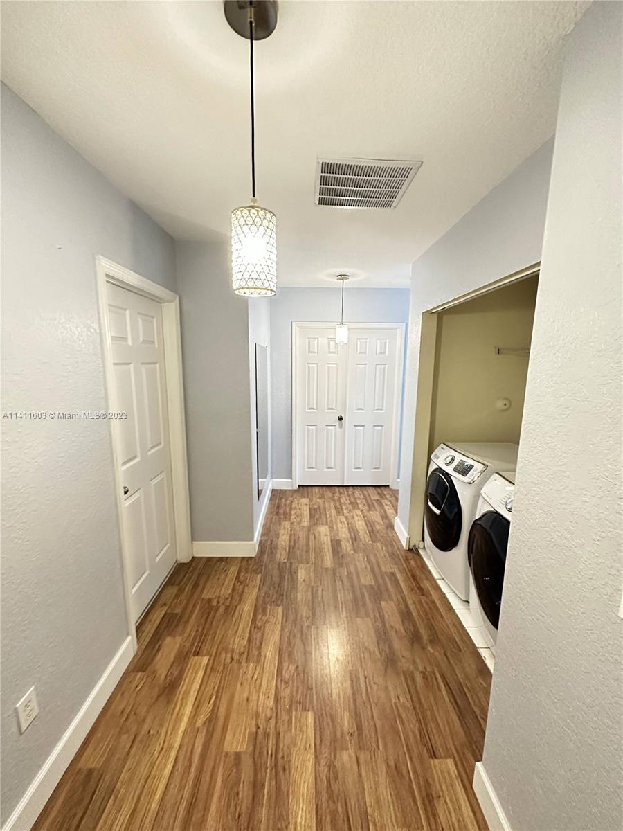 4322 Emerald Vista Lake Worth, FL 33461 - Photo 21 of 40 a view of a room with wooden floor and window