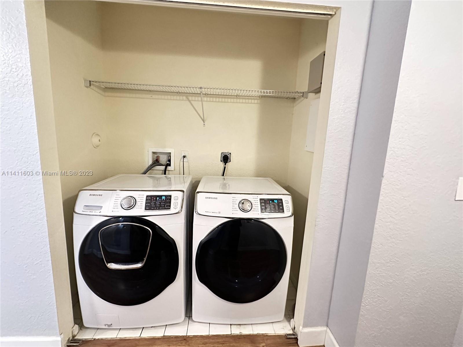4322 Emerald Vista Lake Worth, FL 33461 - Photo 24 of 40 a utility room with dryer and washer