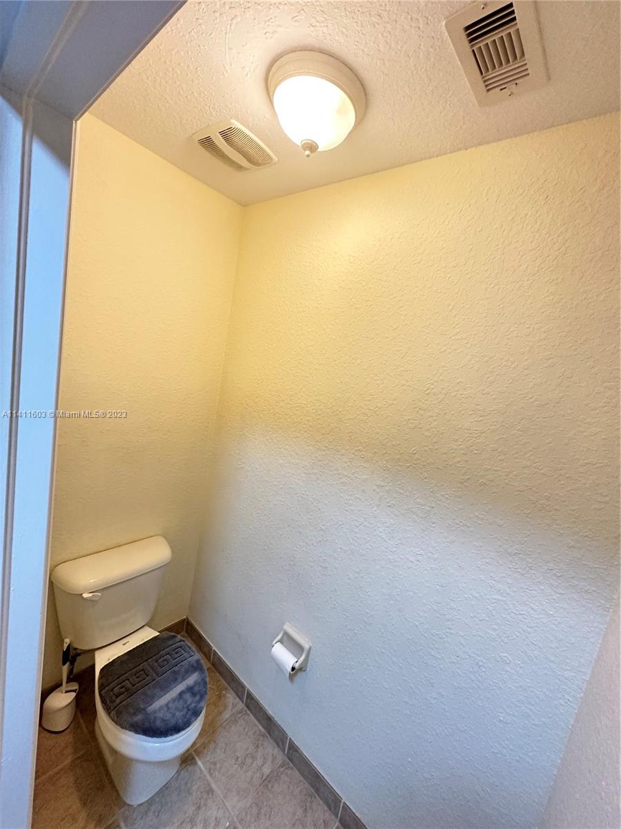 4322 Emerald Vista Lake Worth, FL 33461 - Photo 33 of 40 a bathroom with a toilet and a sink