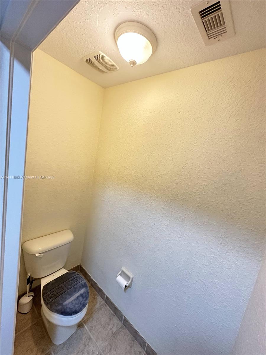 4322 Emerald Vista Lake Worth, FL 33461 - Photo 39 of 40 a bathroom with a toilet and a sink