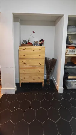 a room with a black white checkered floor