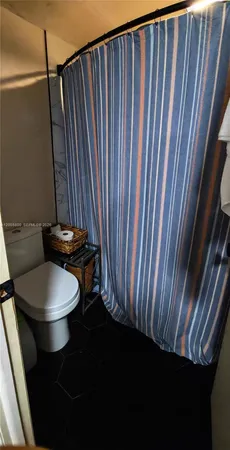 a bathroom with a toilet and a sink