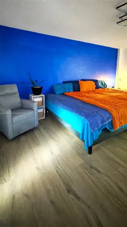 a room with pool table and a couch