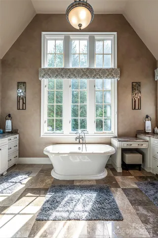 a living room with furniture fireplace and flat screen tv