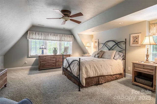a bathroom with a granite countertop sink a mirror a shower and a bathtub