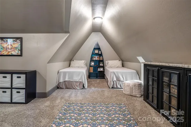 a roof deck with table and barbeque grill