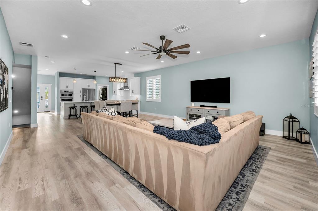 5650 Egrets Place New Port Richey, FL 34652 - Photo 16 of 73 a living room with furniture and a flat screen tv