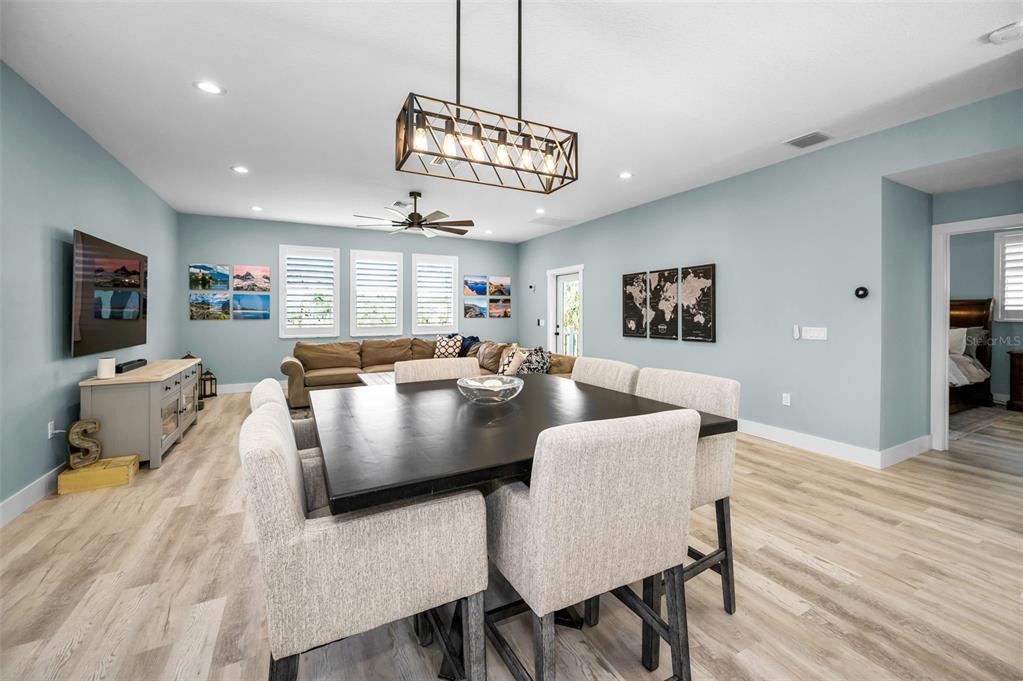5650 Egrets Place New Port Richey, FL 34652 - Photo 18 of 73 a view of a dining room with furniture window and wooden floor