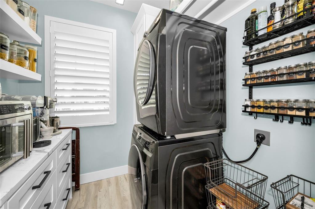 5650 Egrets Place New Port Richey, FL 34652 - Photo 28 of 73 a utility room with dryer and washer