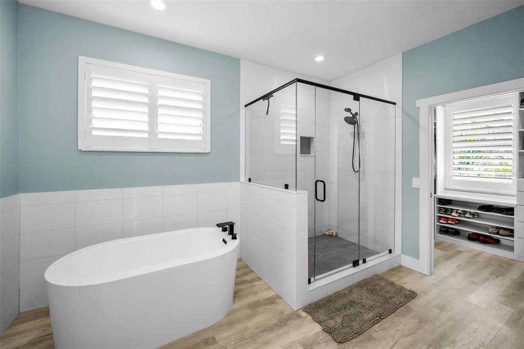 5650 Egrets Place New Port Richey, FL 34652 - Photo 34 of 73 a bathroom with a bathtub and a shower