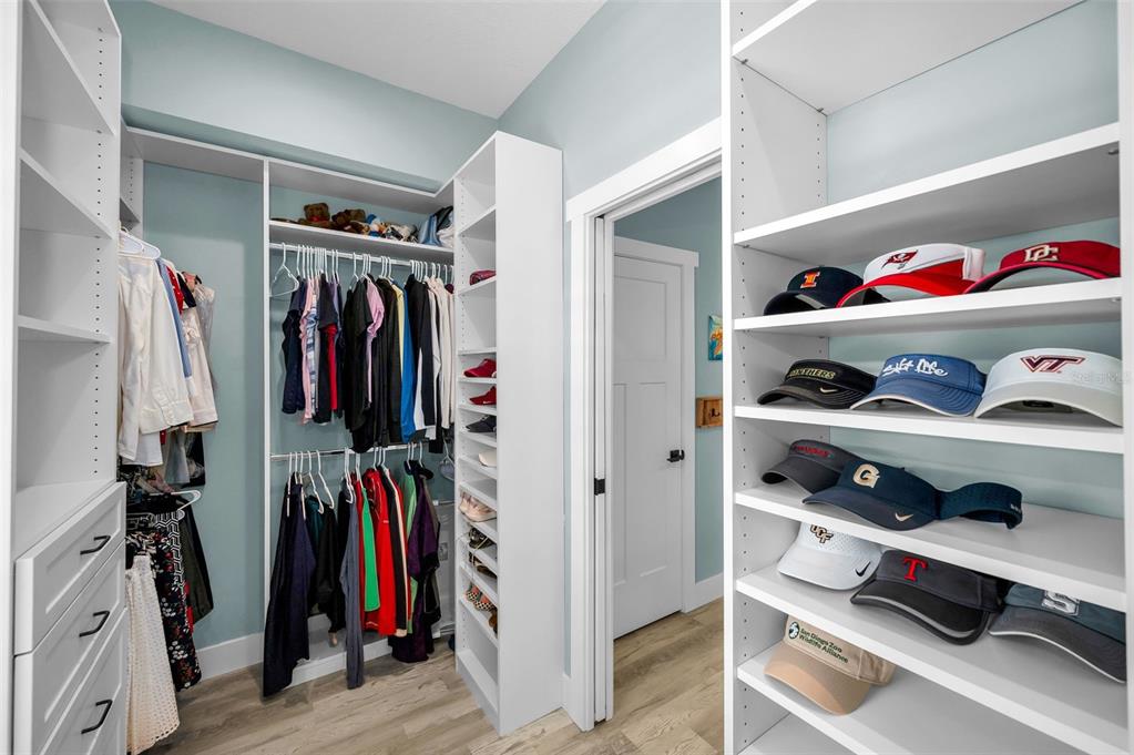 5650 Egrets Place New Port Richey, FL 34652 - Photo 42 of 73 a view of walk in closet with clothes and shoes
