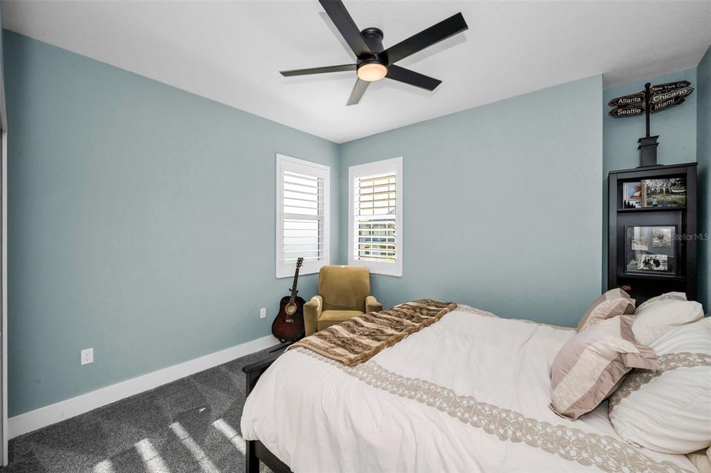 5650 Egrets Place New Port Richey, FL 34652 - Photo 47 of 73 a bedroom with a bed and a window