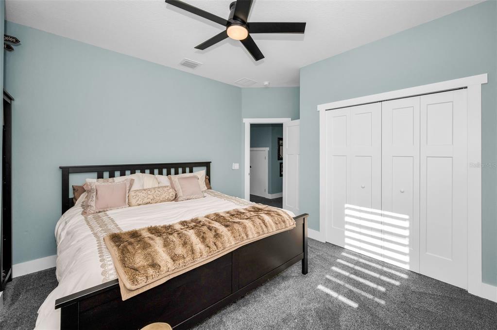 5650 Egrets Place New Port Richey, FL 34652 - Photo 48 of 73 a bedroom with a bed and cabinets