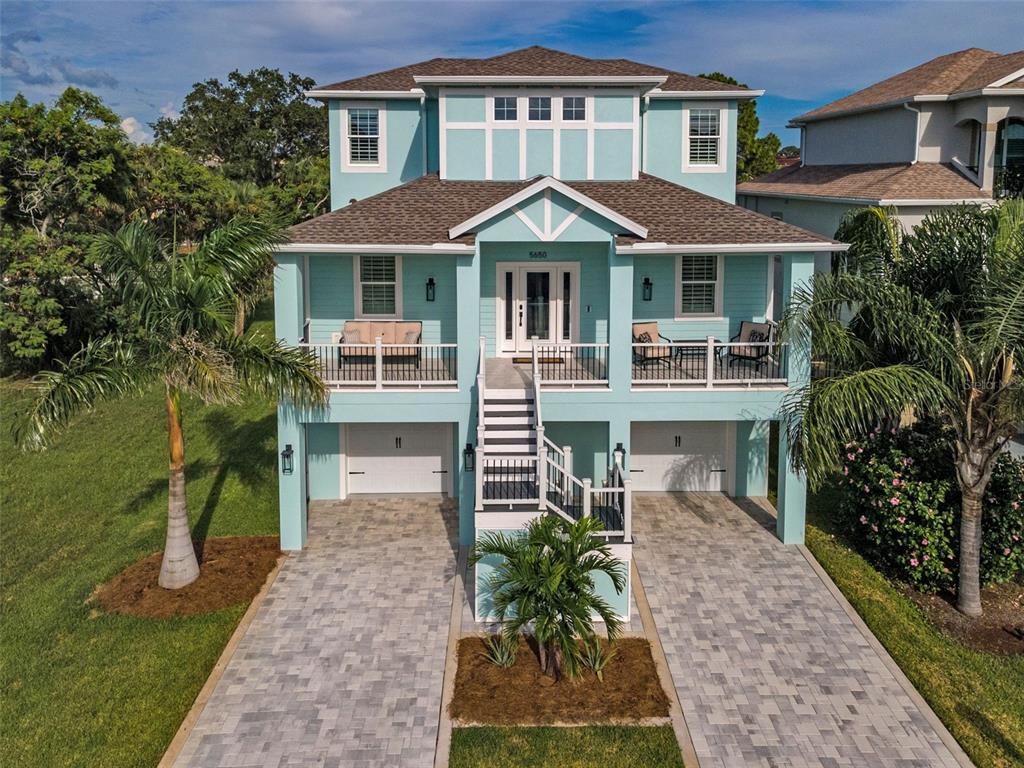 5650 Egrets Place New Port Richey, FL 34652 - Photo 5 of 73 front view of a house with a yard