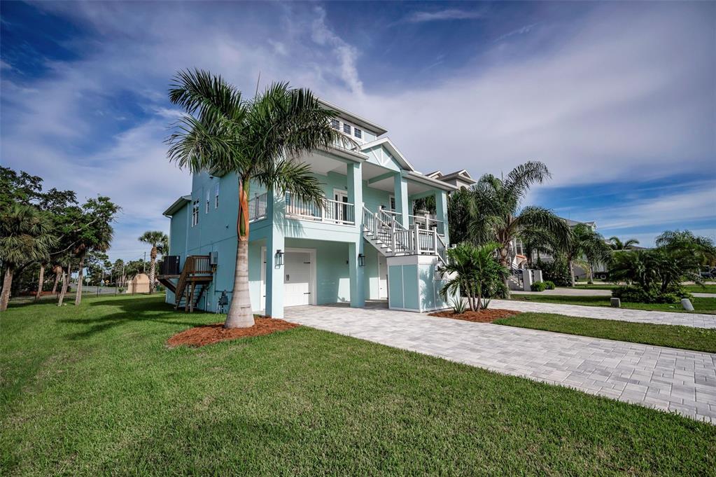 5650 Egrets Place New Port Richey, FL 34652 - Photo 6 of 73 a front view of a house with a yard