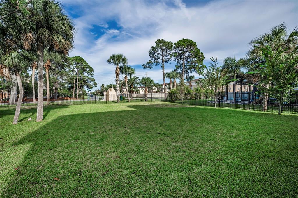 5650 Egrets Place New Port Richey, FL 34652 - Photo 61 of 73 a view of grassy field with benches and trees all around