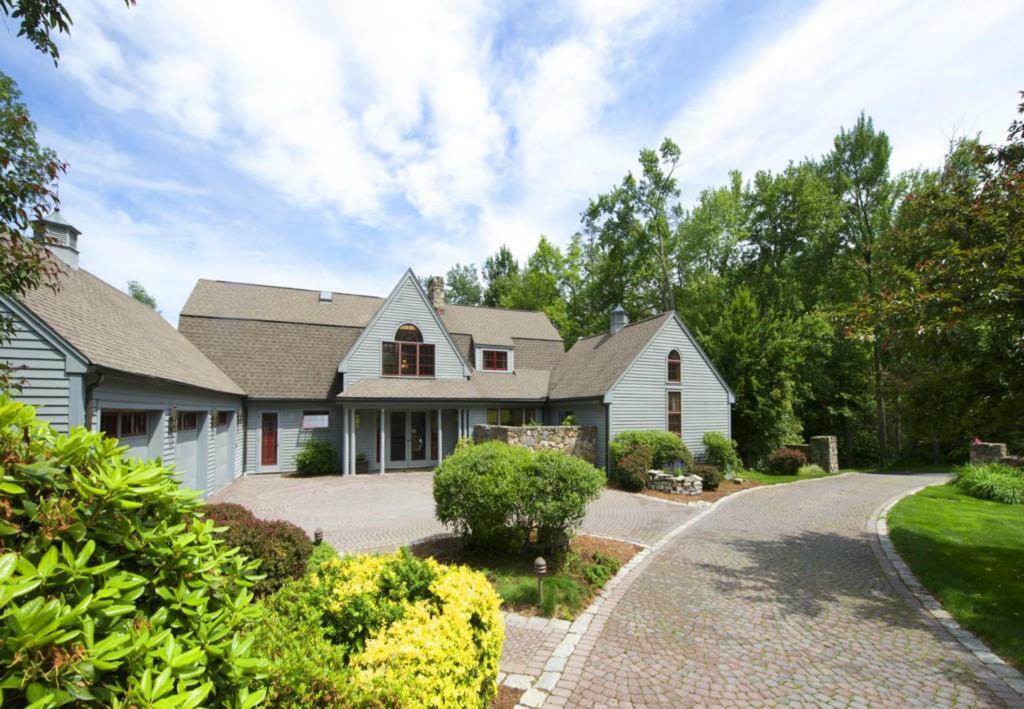 4 Up The Road Simsbury, CT 06092 - Photo 1 of 1 a front view of a house with a garden