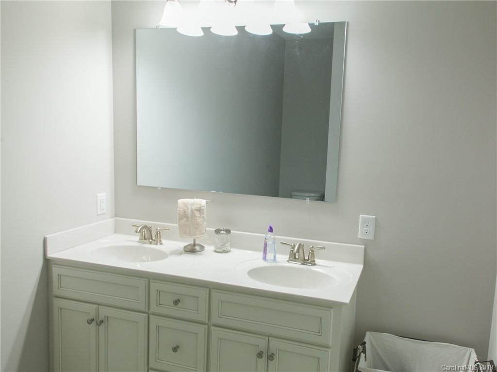 3018 Ranger Road, Unit 2B Clover, SC 29710 - Photo 15 of 23 a bathroom with a sink vanity and a mirror