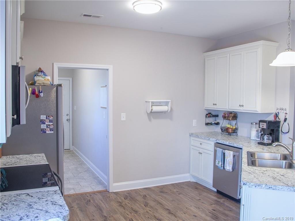 3018 Ranger Road, Unit 2B Clover, SC 29710 - Photo 9 of 23 a kitchen with stainless steel appliances granite countertop a sink stove and refrigerator