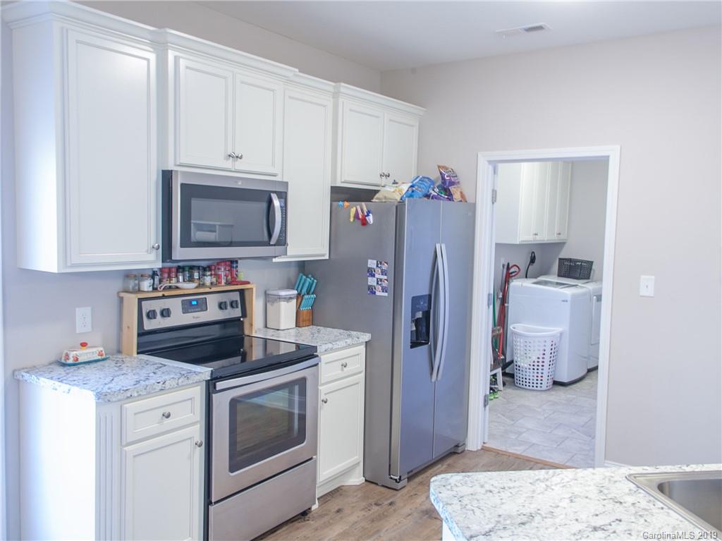 3018 Ranger Road, Unit 2B Clover, SC 29710 - Photo 10 of 23 a kitchen with a stove sink and a refrigerator