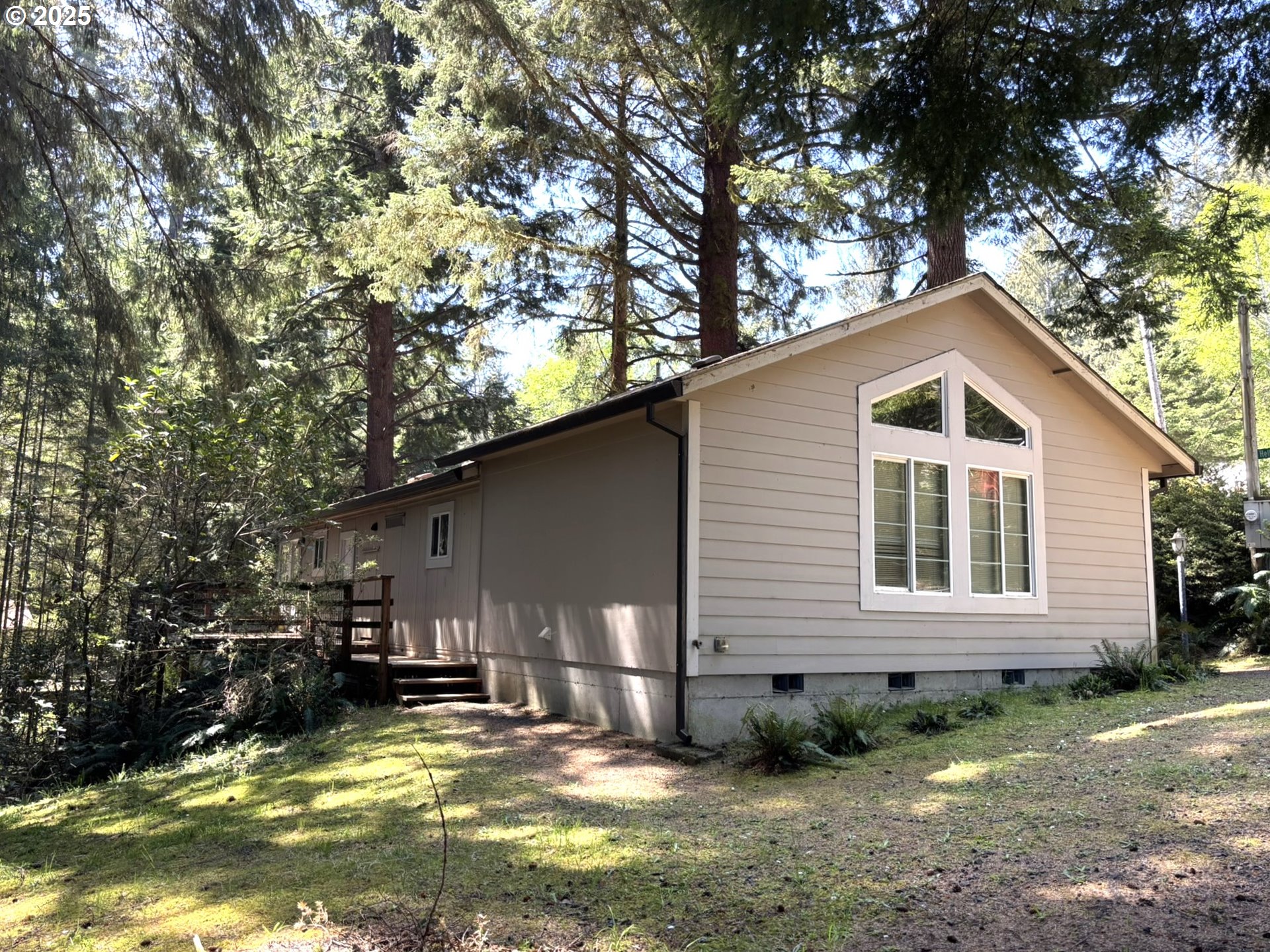 5336 Buckskin Bob Florence, OR 97439 - Photo 2 of 36 a view of a house with backyard and sitting area