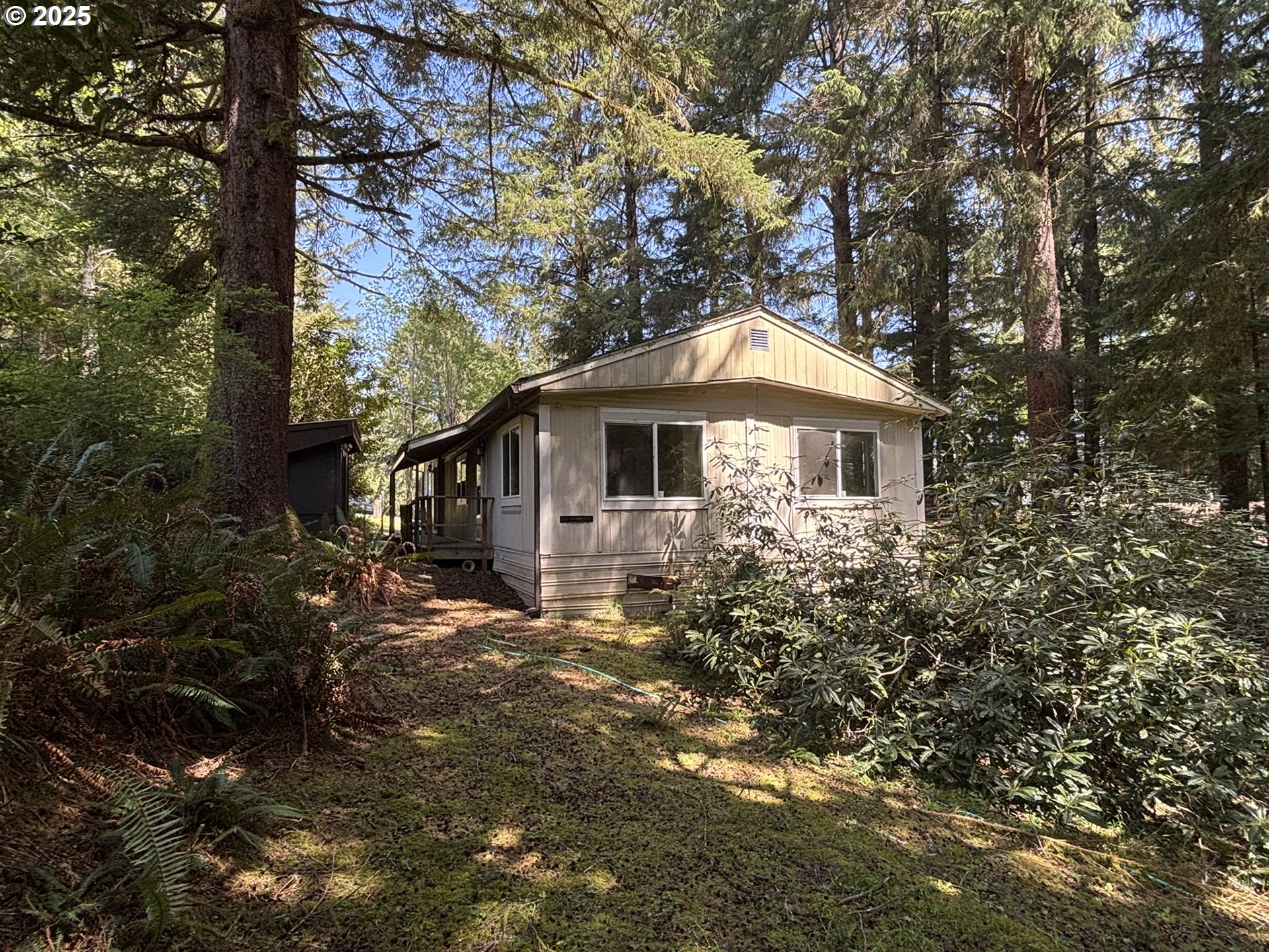 5336 Buckskin Bob Florence, OR 97439 - Photo 29 of 36 a front view of a house with garden