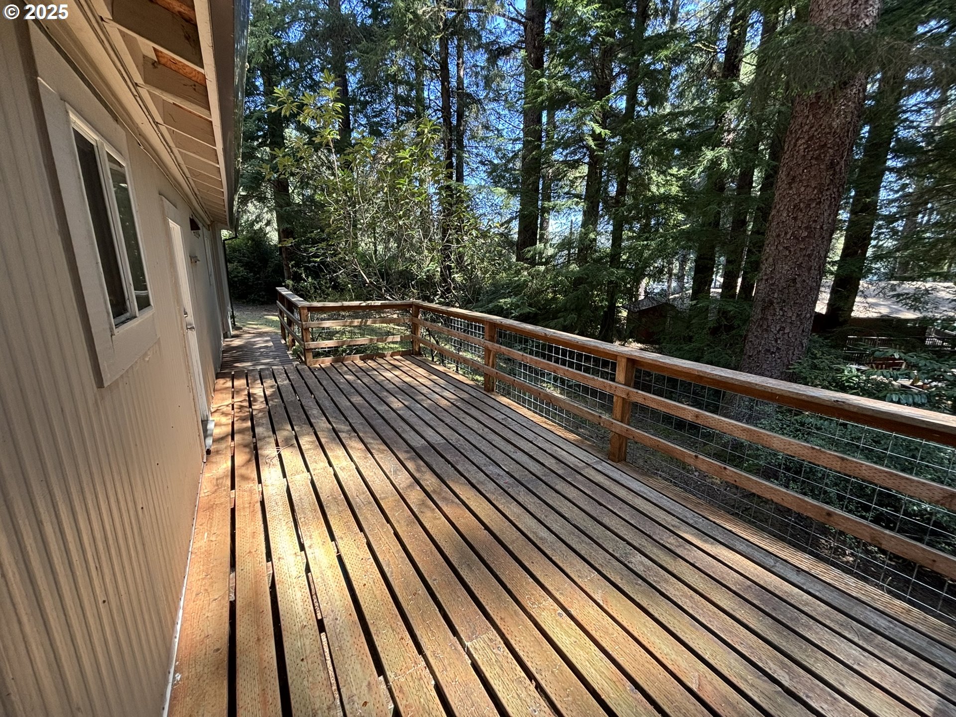 5336 Buckskin Bob Florence, OR 97439 - Photo 31 of 36 a view of backyard with deck and wooden floor