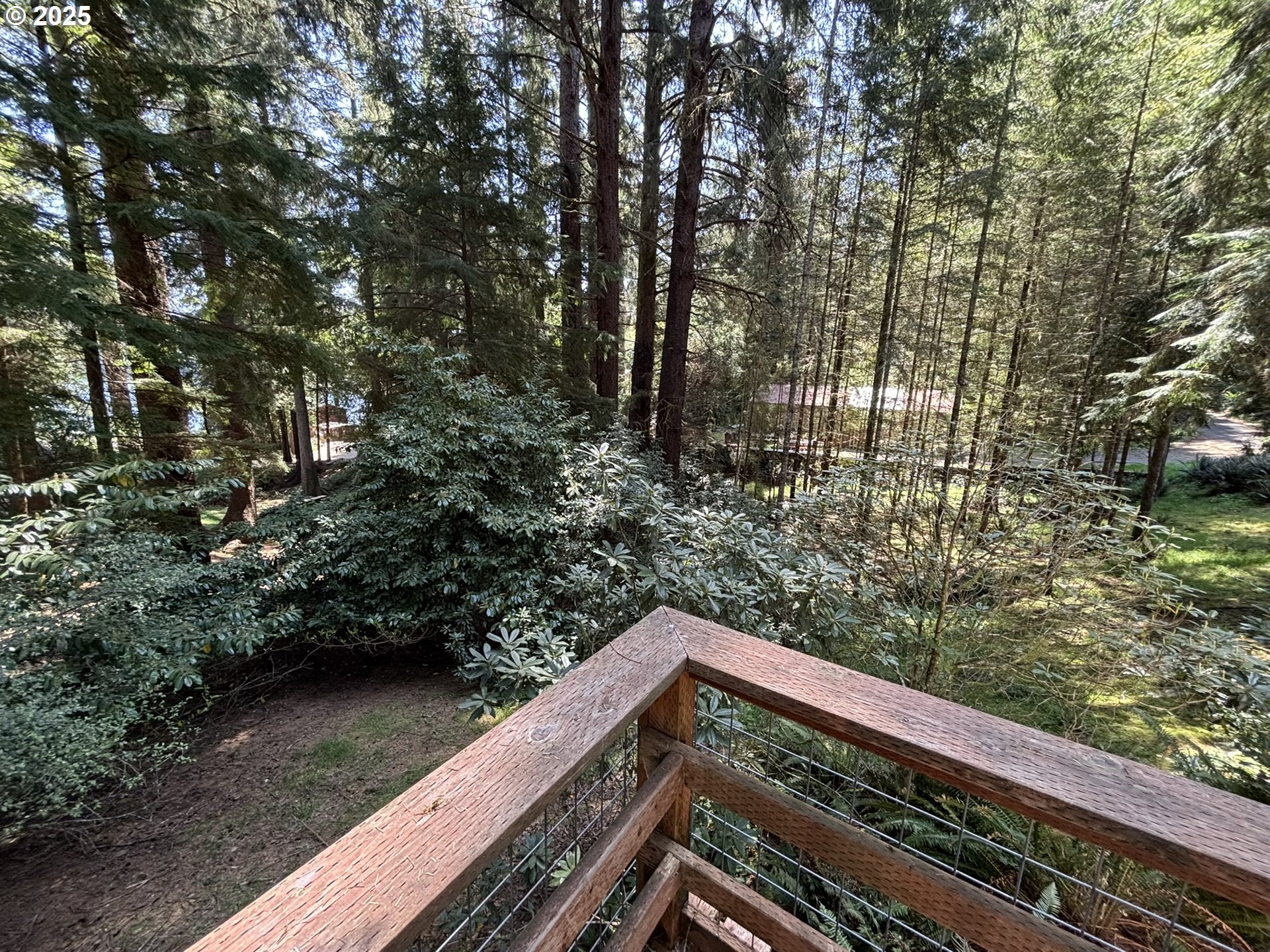 5336 Buckskin Bob Florence, OR 97439 - Photo 33 of 36 a view of balcony with wooden floor and fence