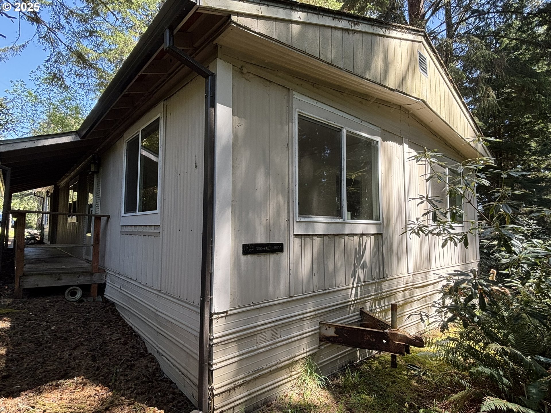 5336 Buckskin Bob Florence, OR 97439 - Photo 34 of 36 a view of a house with a door and wooden walls