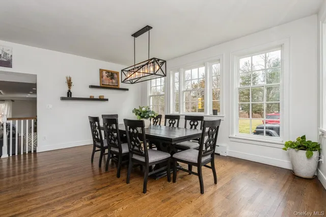 a dining room with furniture window wooden floor