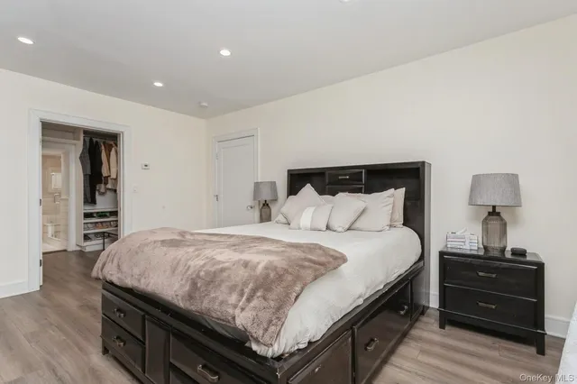 a bedroom with a bed and a closet